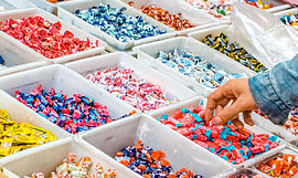 Hand picking up candy Hand picking up candy